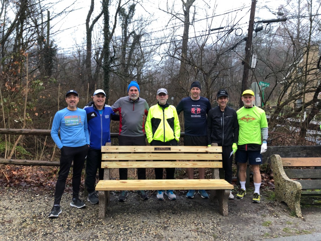 6 SRC runners in front of brand-new park bench.