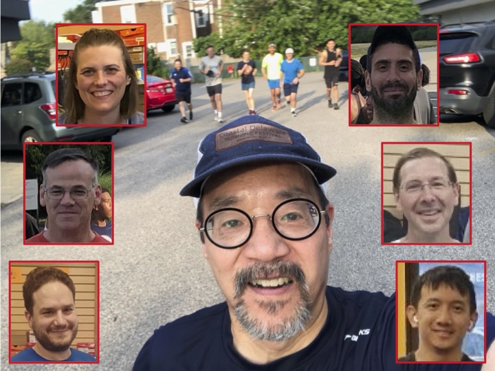 Runners nestled amid clothing displays in Jenkintown Running Company with the selfer cut and pasted in from an outdoor shot