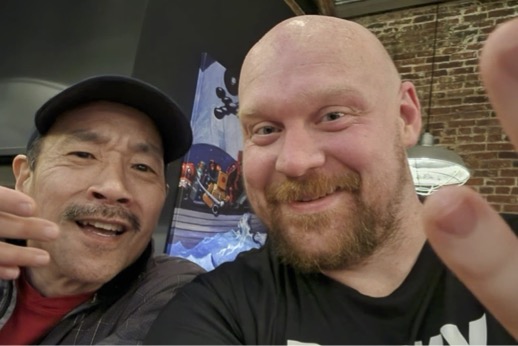 Faces of 2 runners as seen from bar at Human Robot