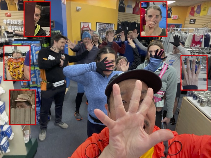 Runners with faces in line behind their own or someone else's hand