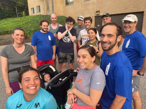 Runners around a baby in a carriage
