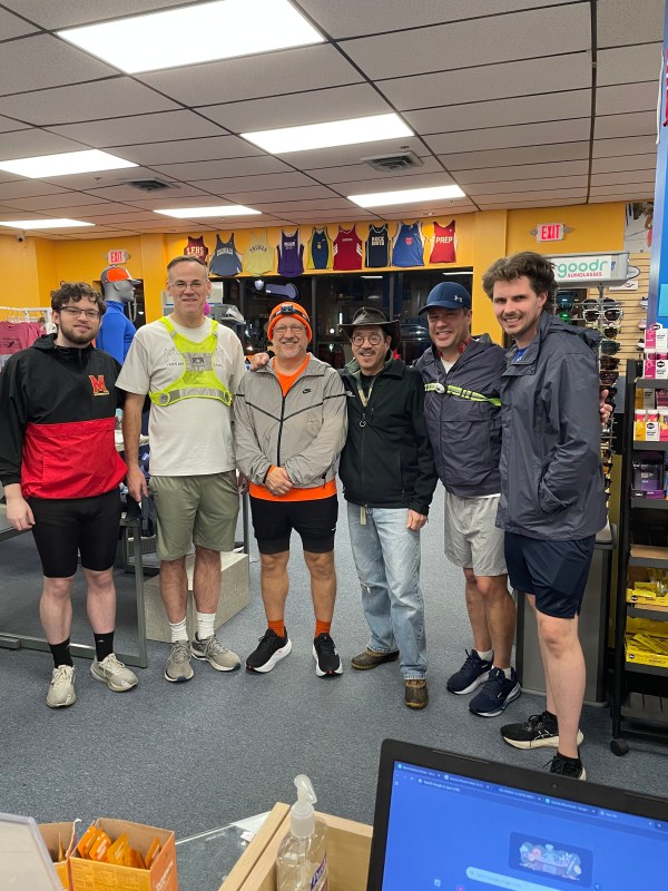 A row of runners in runner gear with me in walking gear