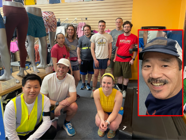Runners surrounding the treadmill in the store with some looking off to the left