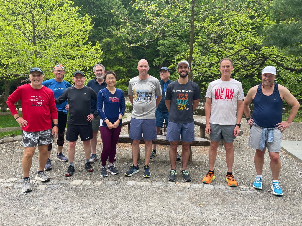 Runners in mild weather running gear arrayed near the Valley Green drinking fountain
