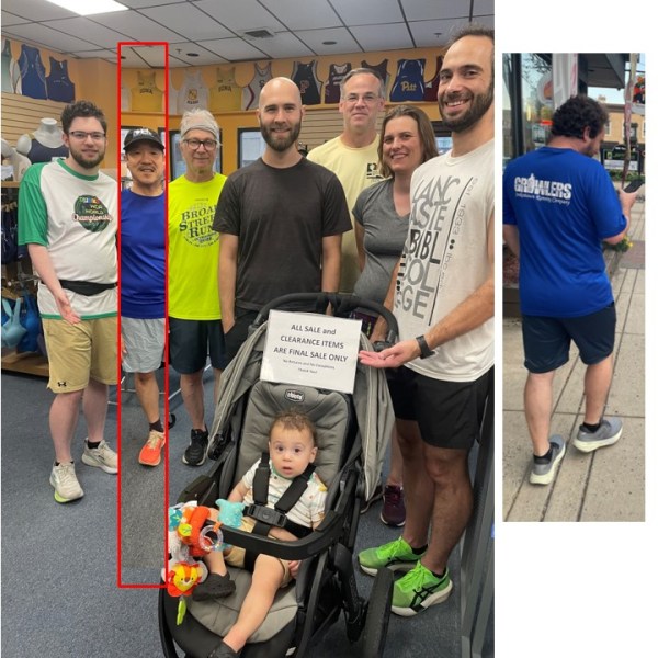 Surrounding running stroller with Torin inside and an all-sales-final-for-sale-items sign above his head held by dad Train Dave. Pic on side of J'Adam turning away outside as we exit.